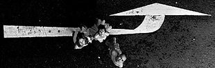 bonemap perfomers on the street in singapore photographed looking down on an arrow painted on the road 2001