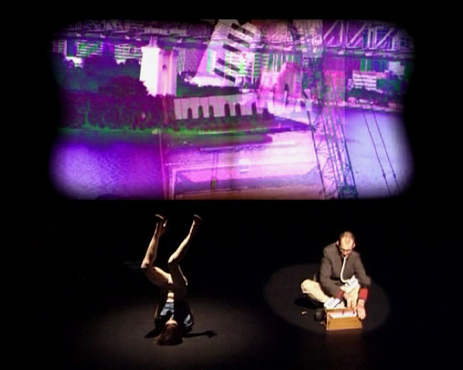 Dancer and musician with a projected image of the Story Bridge